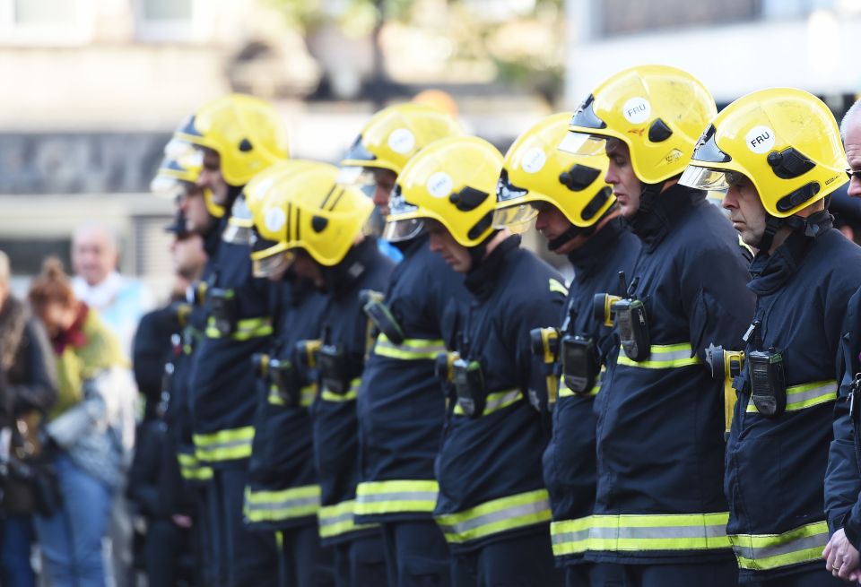  Firefighters take part in a one minute silence to mark the tram crash at the Cenotaph in Croydon