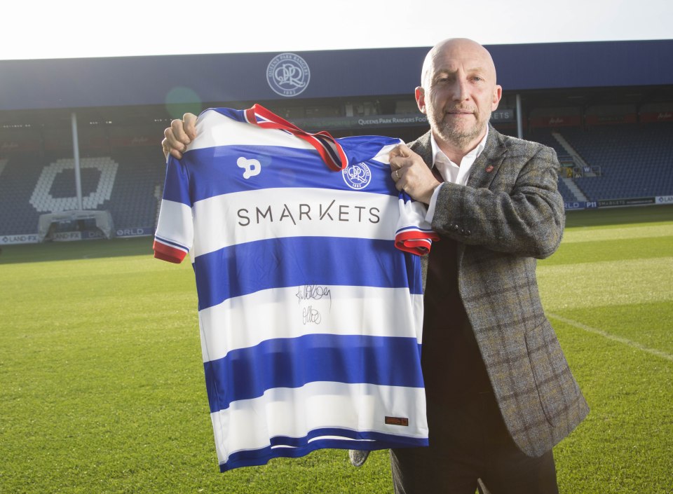 New QPR manager Ian Holloway poses with a club shirt on the pitch at Loftus Road