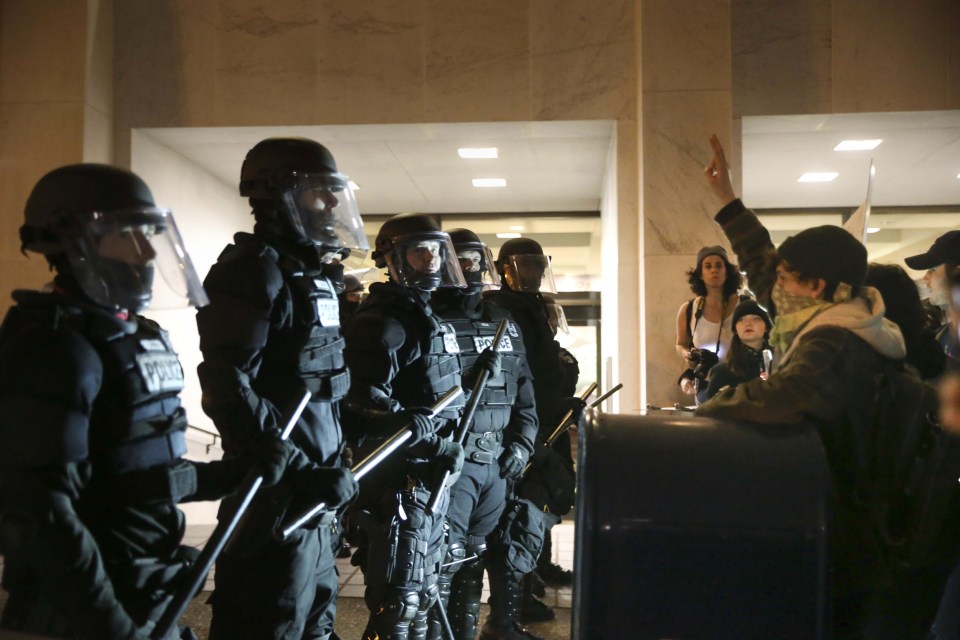  Cops dressed in riot gear to deal with the protestors in Portland, Oregon, last night