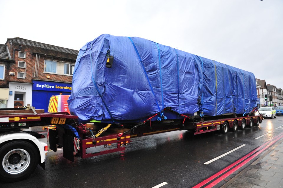  The damaged Croydon tram in transport along West Wickham, High Street this morning