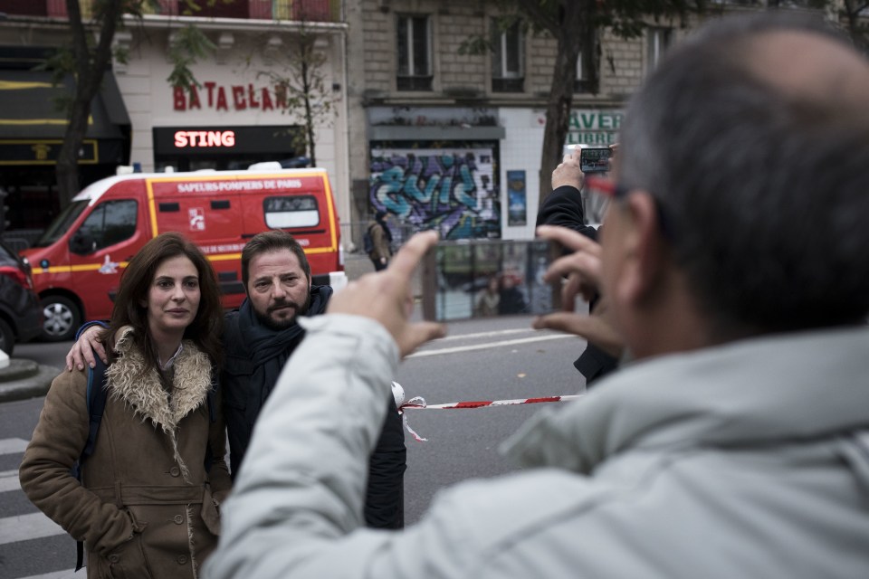  People take pictures in front of the Bataclan concert hall in Paris