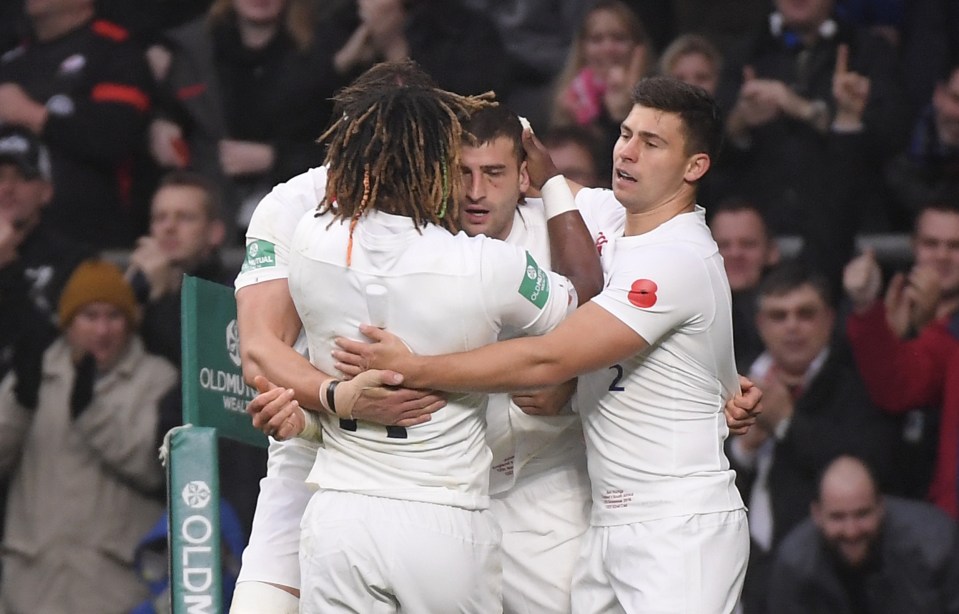  The poppy can be seen on players' tops as they celebrate Jonny May's try