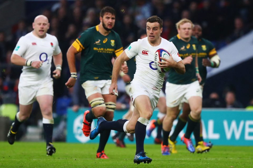  George Ford of England runs with the ball past a flailing South African defence