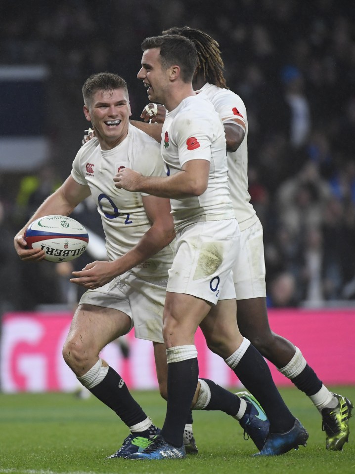  England's Owen Farrell celebrates scoring their fourth try with team mates