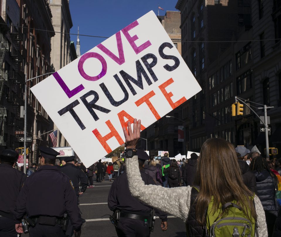  A number of protesters carried signs with Hillary's slogan 'Love Trumps Hate'