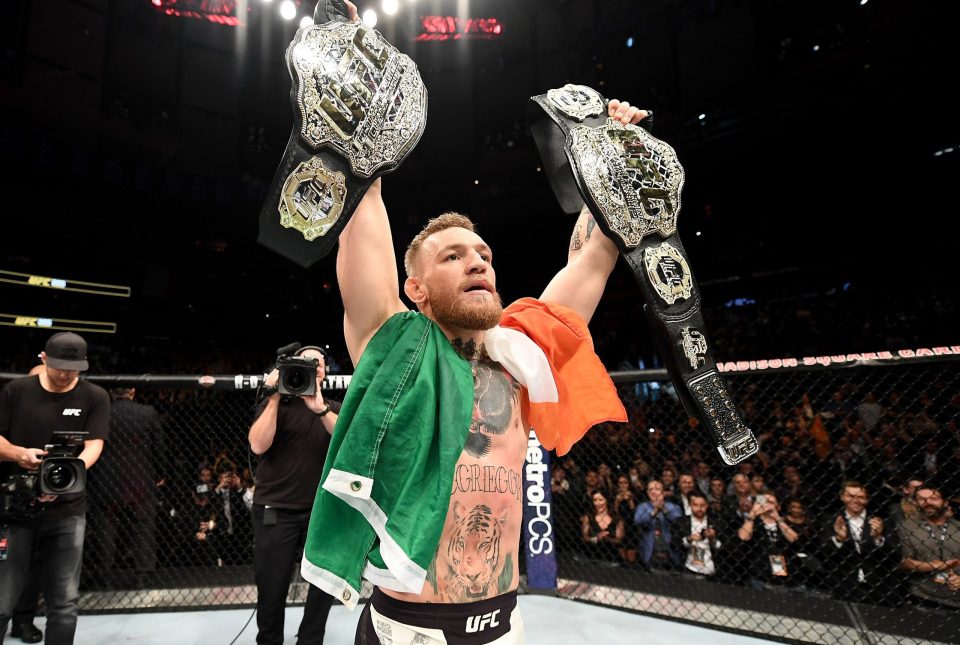  Conor McGregor would not have been able to pose with two belts were it not for Tyron Woodley