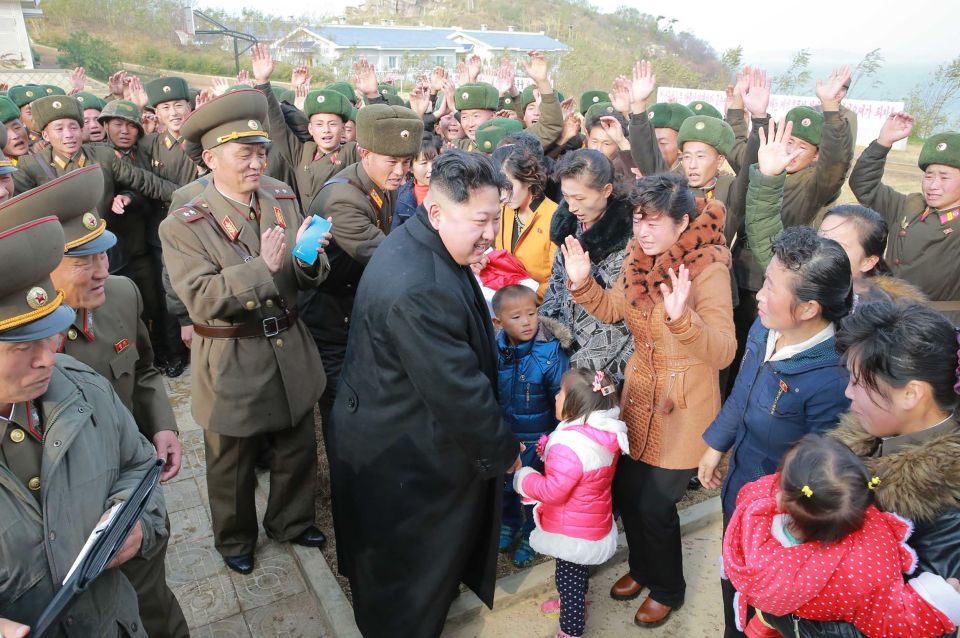  KIM Jong-Un interacts is greeted by friendly crowds while inspecting a defence outpost