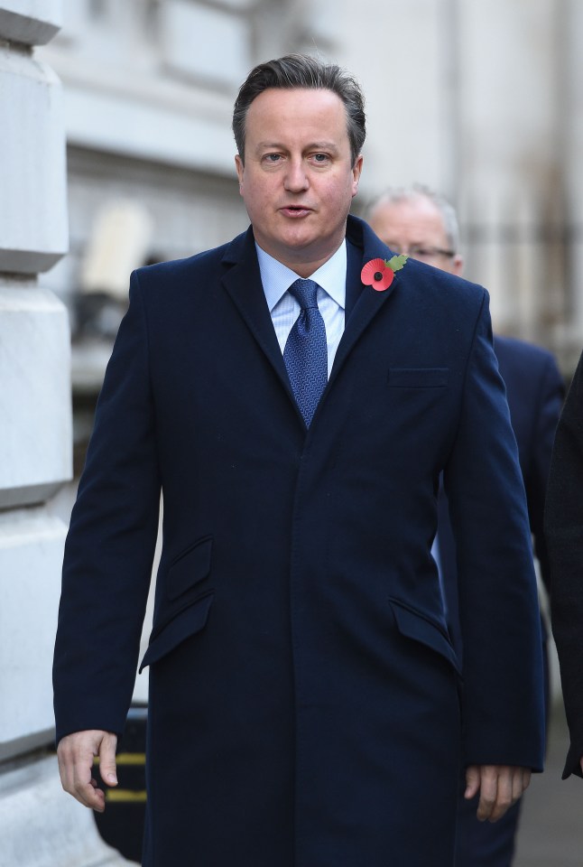 Former Prime Minister David Cameron walks through Downing Street on his way to the annual Remembrance Sunday Service at the Cenotaph memorial in Whitehall