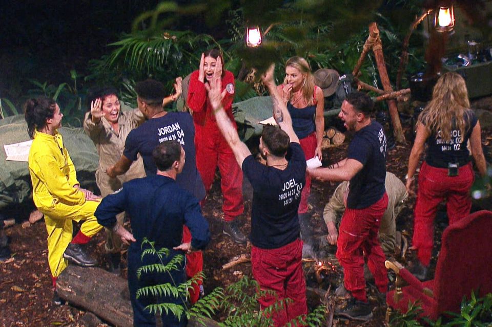 The campmates bond with a group hug