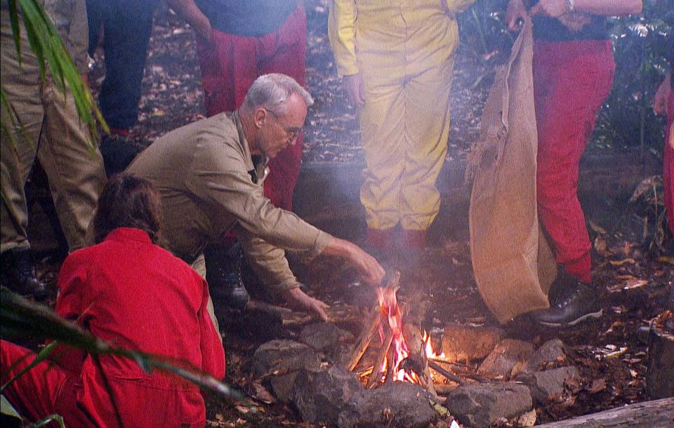 Larry Lamb gets to work and builds the camp a fire