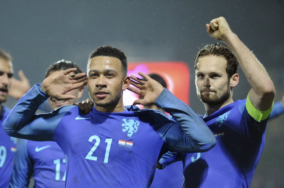  Depay celebrates his first goal with Man Utd and Holland team-mate Daley Blind