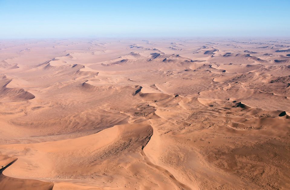  This cool optical illusion appears to show a human face in profile in desert sand dunes