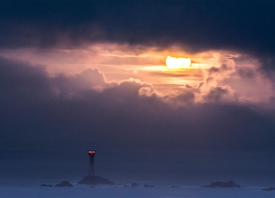  The supermoon sets over the Longships lighthouse at Lands End this morning as the moon reached the nearest point in its orbit around the Earth