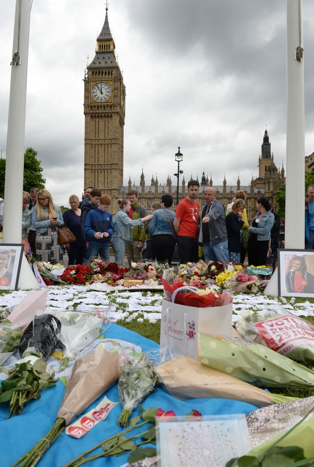 Flowers and tributes left in Parliament Square after the death of Jo cox 