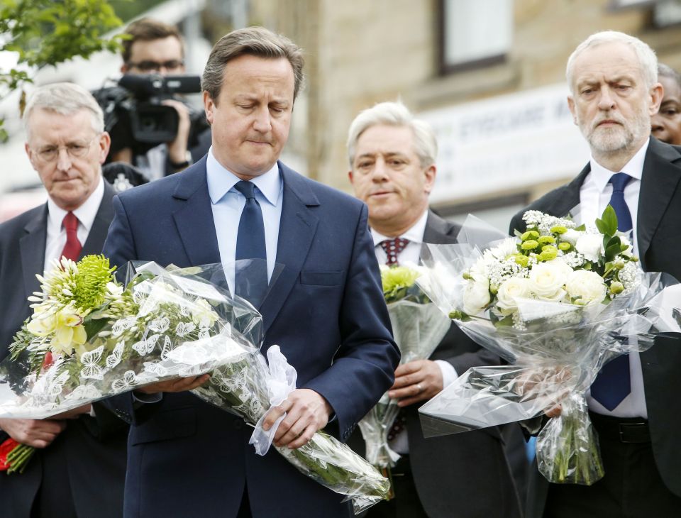  Prime Minister David Cameron and Labour Party leader Jeremy Corbyn lay flowers in tribute to the MP