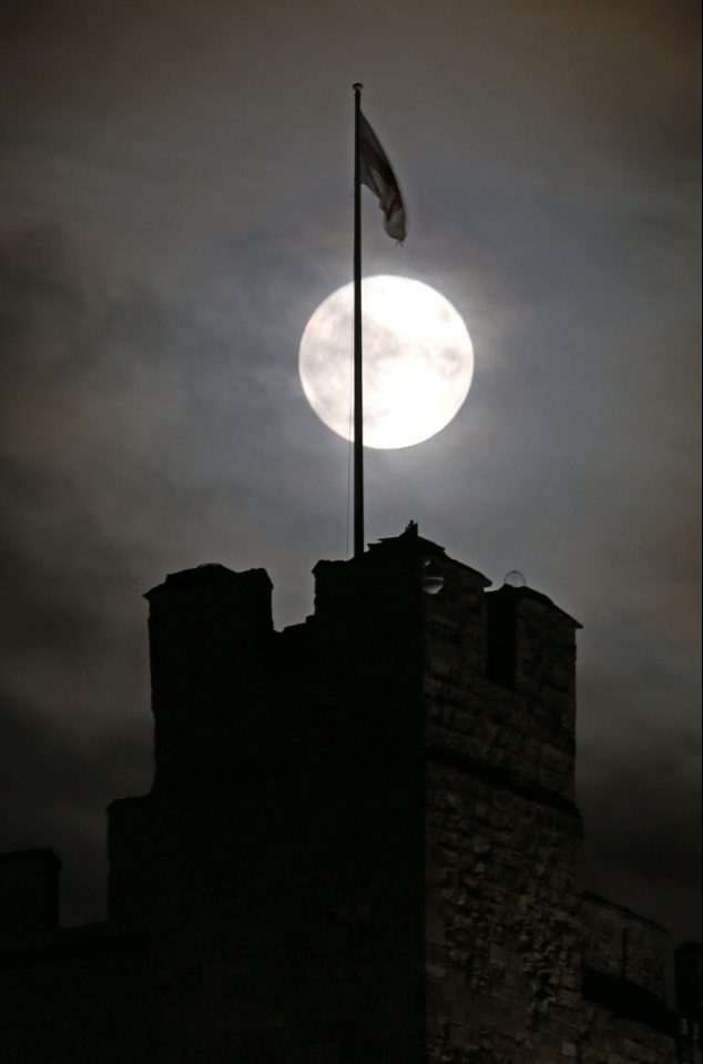  Clouds only slightly got in the way of the supermoon as it loomed over Bamburgh castle in Northumberland