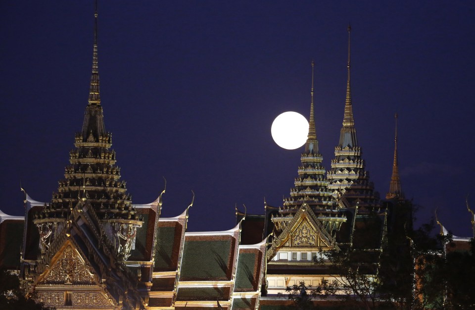  The full moon - 30 per cent brighter than usual - rises over the Grand Palace in Bangkok, Thailand