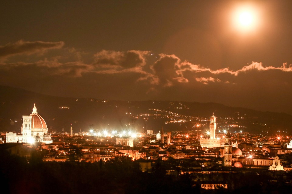  The Supermoon glows in the sky over Florence, Italy, on Monday evening