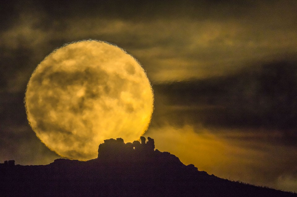  Photographer Andrew Fusek Peters captured a striking image of the moon appearing enormous as it rose over Caer Caradoc in Shropshire this evening