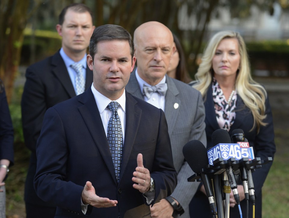  Lead prosecutor Chuck Boring (center left) told reporters: 'It's hard to accept that someone is capable of such evil. He had malice in his heart absolutely."