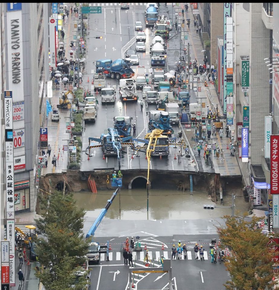  The massive hole - said to be caused by subway construction - filled with water after opening up last week