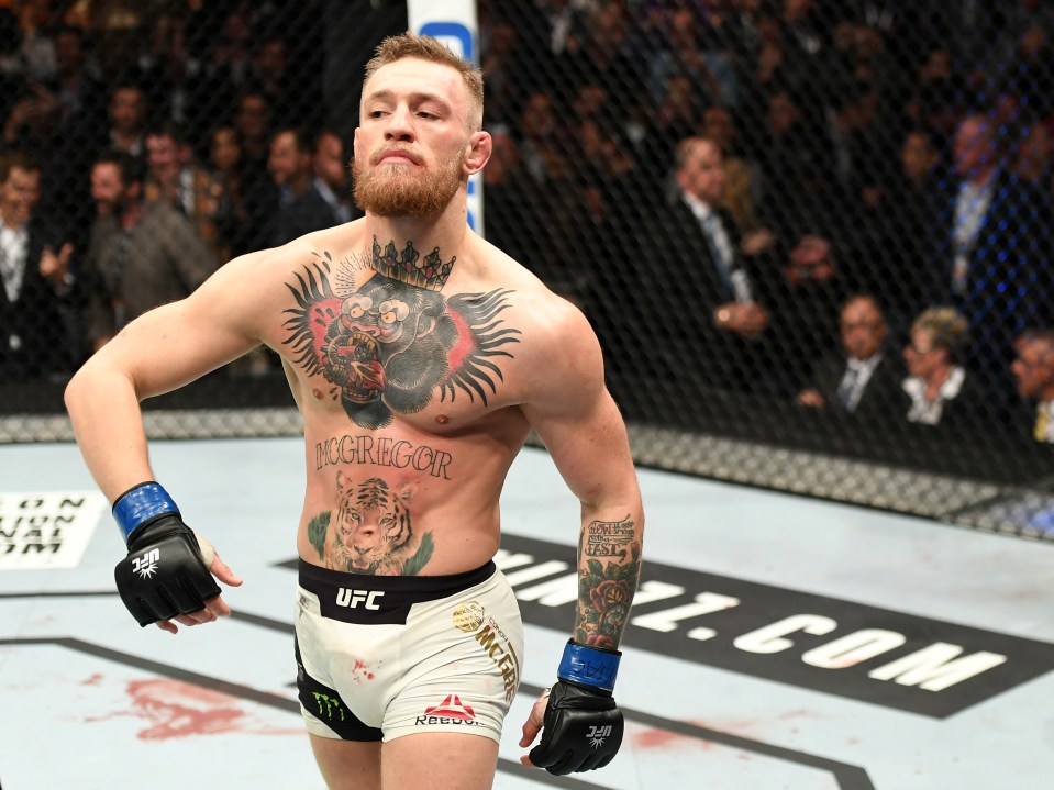  Conor McGregor struts around the ring in WWE-owner Vince McMahon fashion after his win over Eddie Alvarez