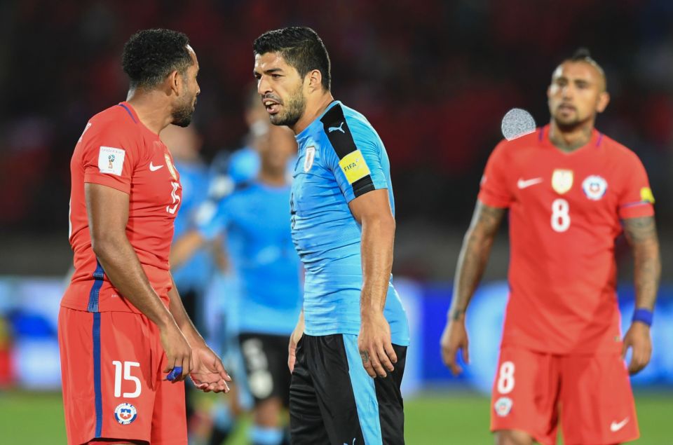  Uruguay's Luis Suarez and Chile's Jean Beausejour argue during their 2018 FIFA World Cup qualifier