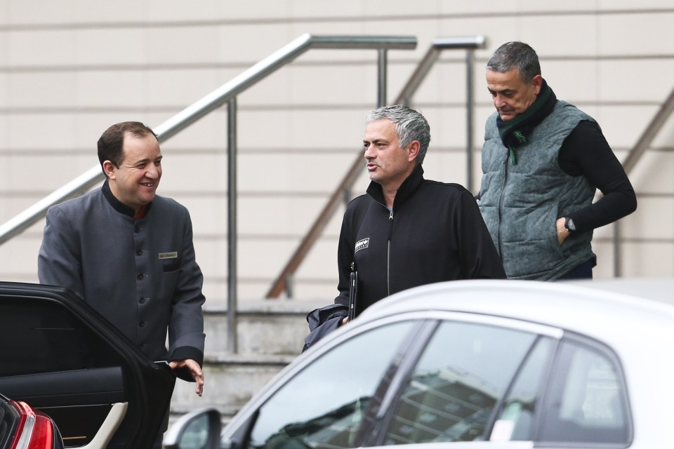  Jose Mourinho jokes with hotel staff as he leaves for training