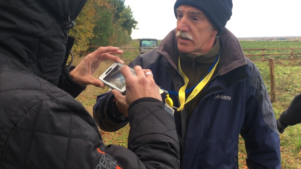  One security guard eventually passed over his identification, at which point the photographers agreed to leave