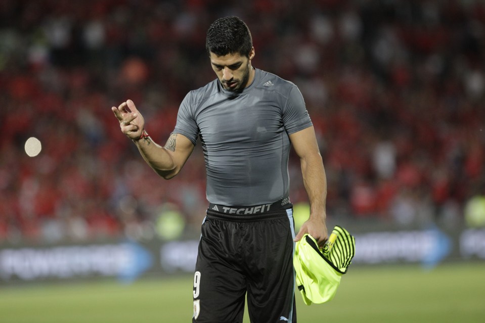  Luis Suarez was caught sticking his finger up towards Chile supporters last night