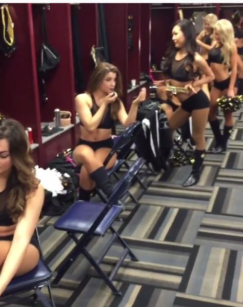  US NFL cheerleaders pose in their dressing room