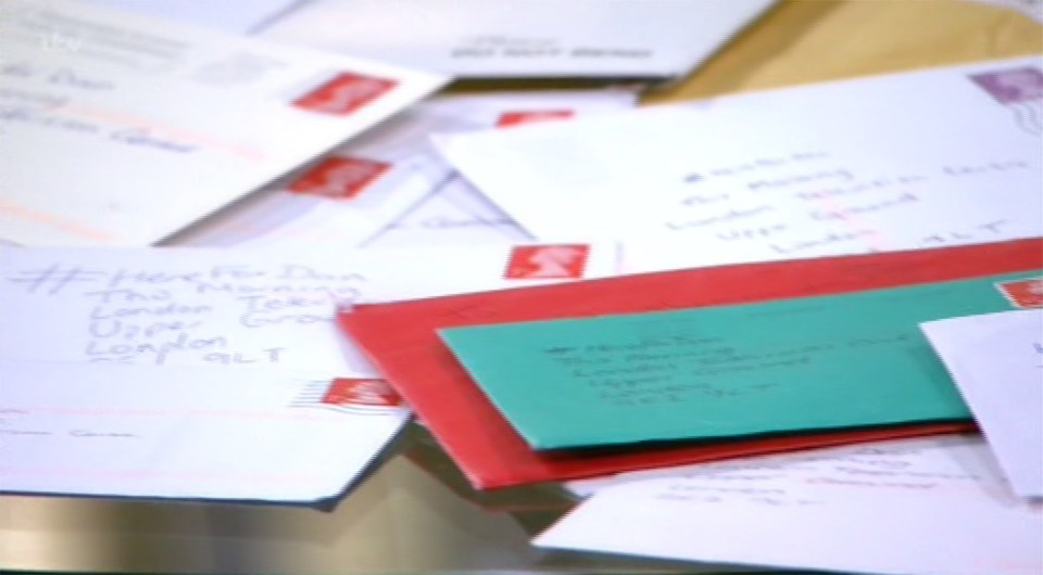  The table was piled high with Christmas cards