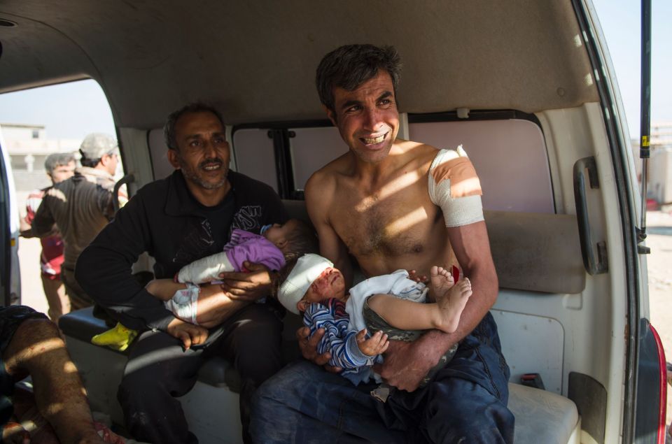 Mosul residents Hassan (R) and his broth