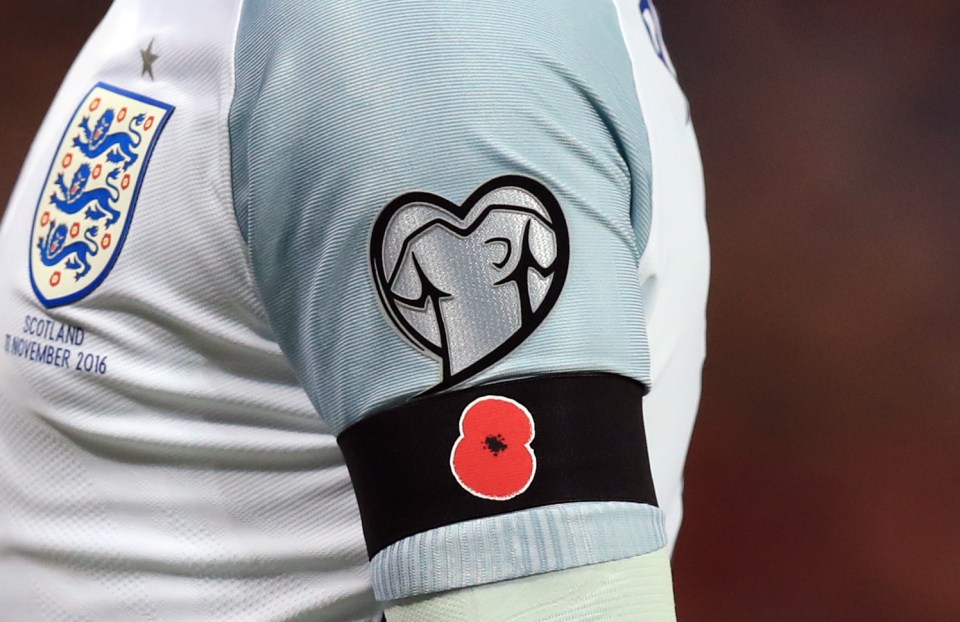  A detailed view of Wayne Rooney's black armband with a poppy