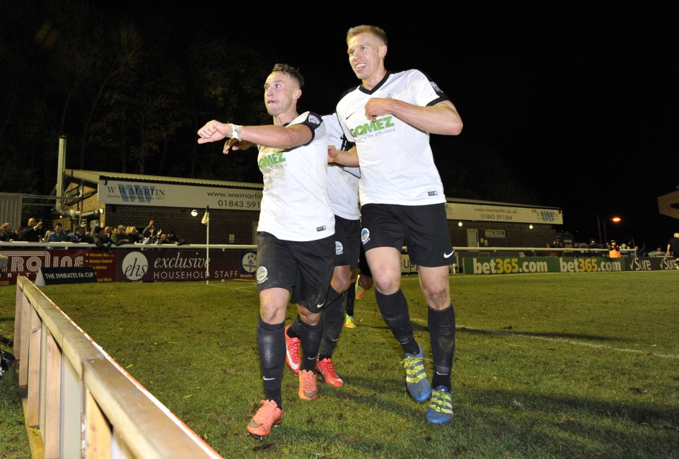  Earlier, Dover's Ricky Miller celebrates scoring their first goal with teammates