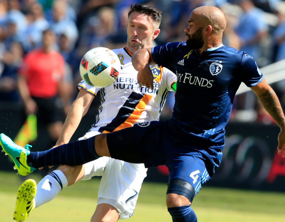  LA striker Robbie Keane, seen tussling with Sporting Kansas City defender Kevin Ellis, has been one of the best imports from the Prem to the MLS