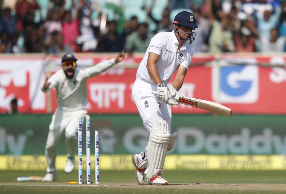  England's captain Alastair Cook is bowled out by India's Mohammed Shami