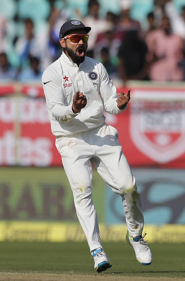  Virat Kohli celebrates the dismissal of England's Haseeb Hameed