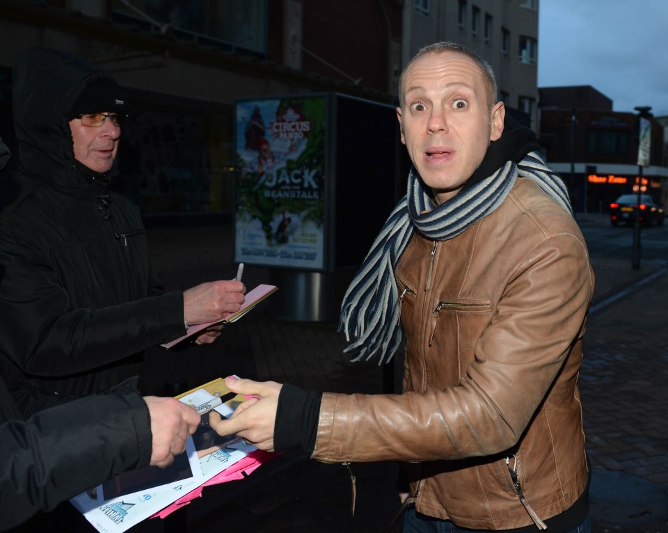  Judge Rinder looks somewhat stunned as she signs autographs for fans