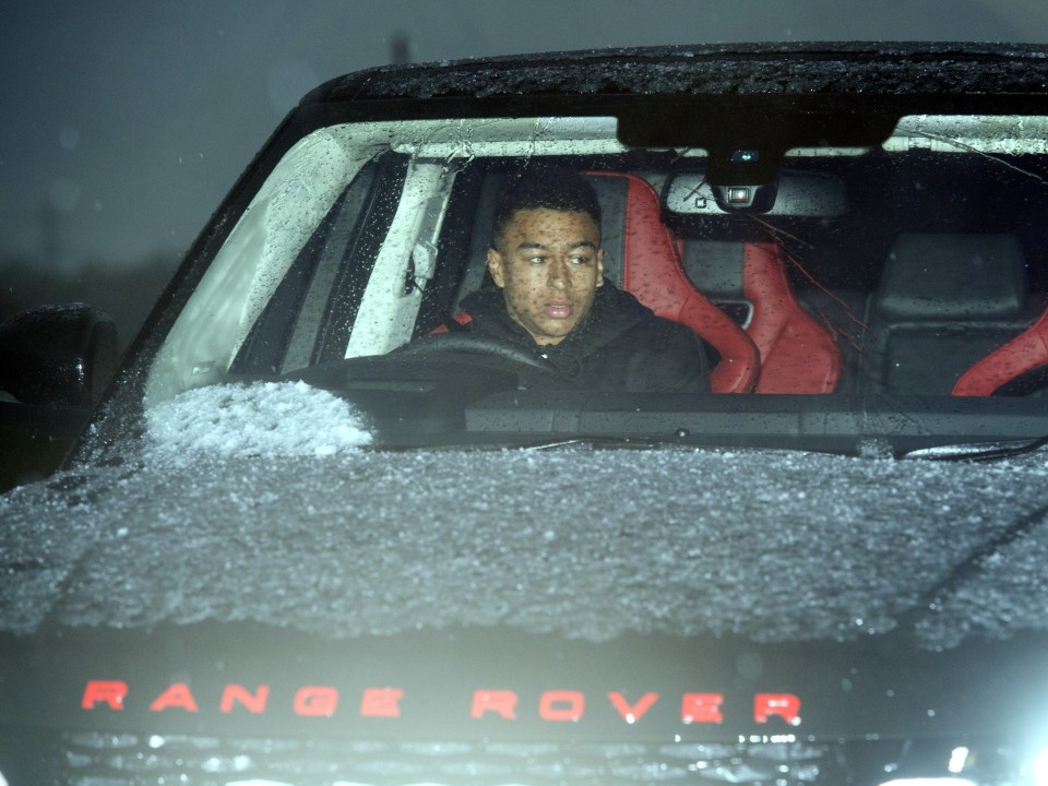  Jesse Lingard arrives at training today in his red-lettered Ranger Rover