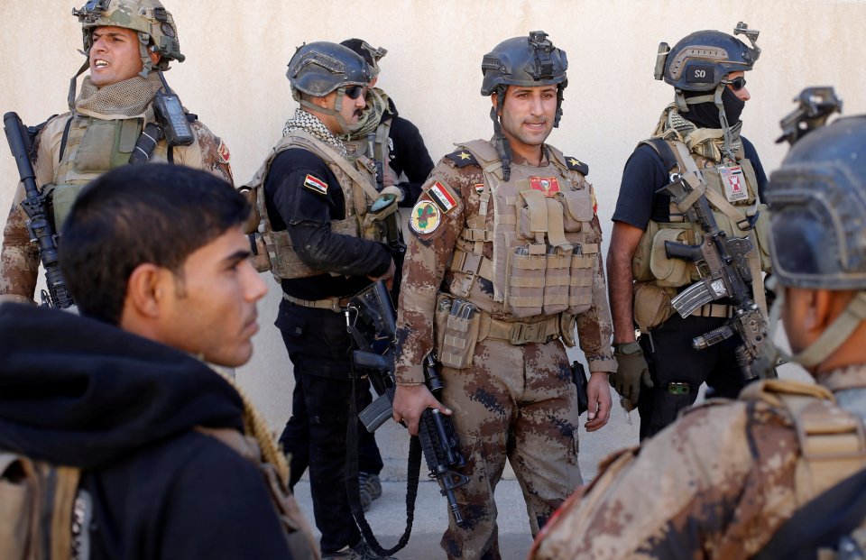 Iraqi special forces soldiers gather during a break in fighting with Islamic State fighters in Mosul,