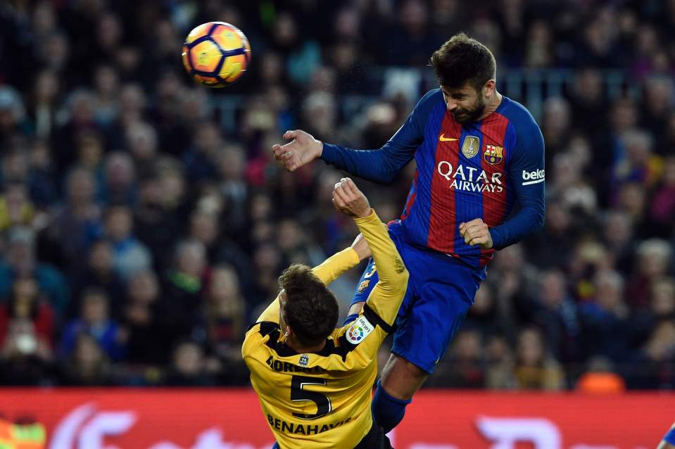  Gerard Pique attempts a header on goal during the La Liga clash