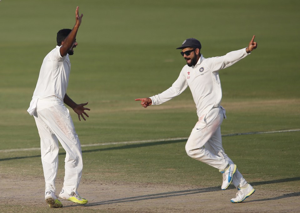  Virat Kohli and Ravichandran Ashwin celebrate the dismissal Hameed as India's most potent players