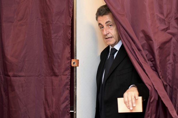 Nicolas Sarkozy cast his vote in the rightwing primary election on Sunday morning but was forced to concede defeat