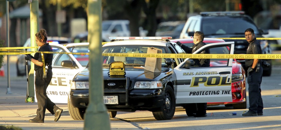  The cop was shot through the window of his police car as he sat outside police HQ