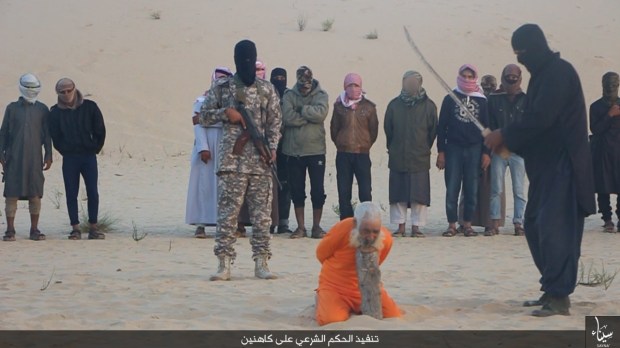 The masked ISIS executioner raises his sabre above his 100 yea-old victim's neck