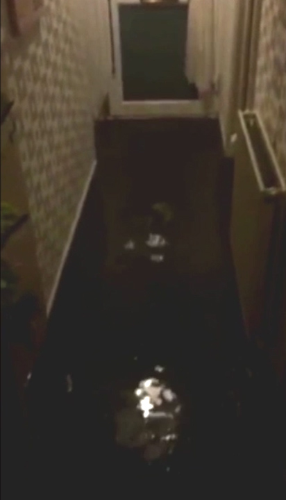  Water filled the home's corridor, with the water heard splashing as the owner walks around