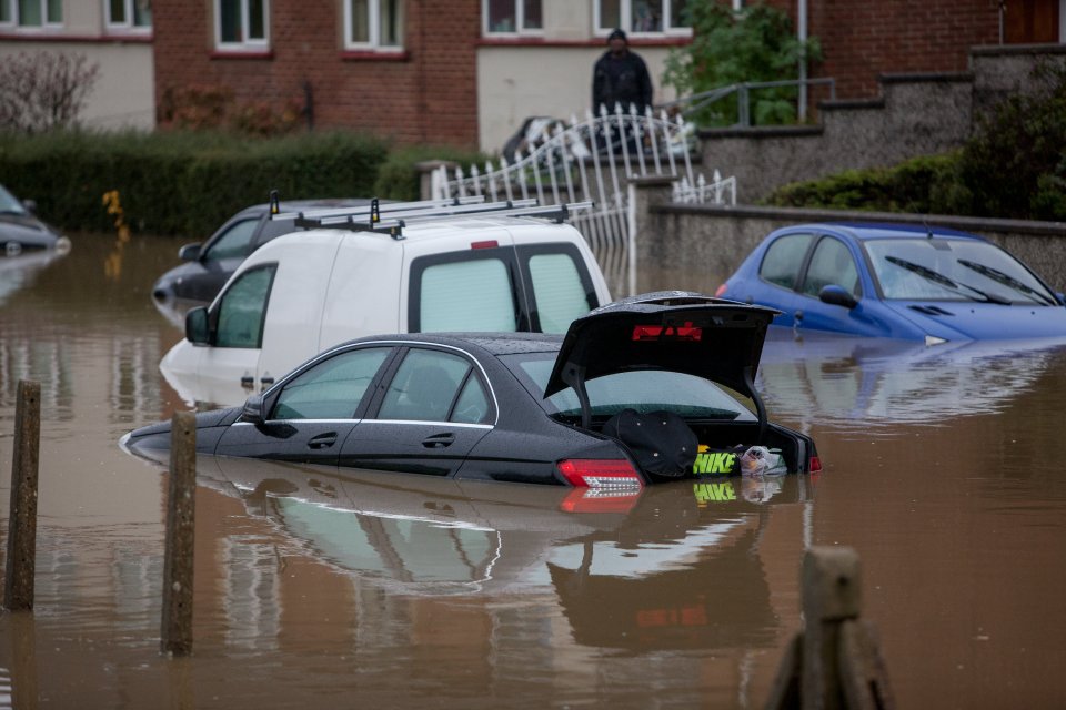  Owners woke to find their parked cars under water, but a couple of vehicles appear to have tried to drive through the flood and got stuck