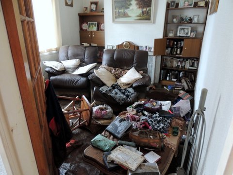  Desperate home owners tried to keep their belongings dry by piling them up