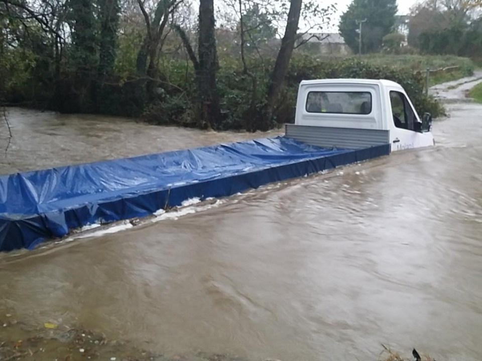  A lorry caught up in a deep flood in Carmarthenshire, South Wales, yesterday